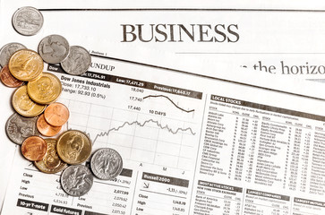 Coins on the business newspaper.