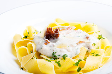 Pasta with cream sauce with chanterelle