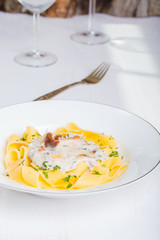 Pasta with cream sauce with chanterelle