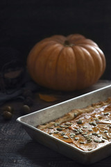 Pumpkin pie on the  wooden table vertical