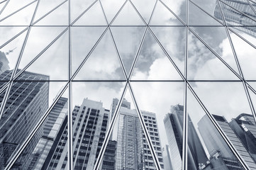 Fototapeta na wymiar Reflection of urban skyline on modern office building