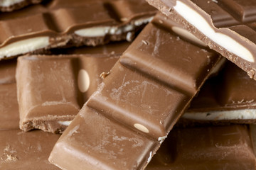 Heap of filled chocolate bars. Food background