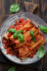 Cannelloni with minced meat and tomato sauce, above view