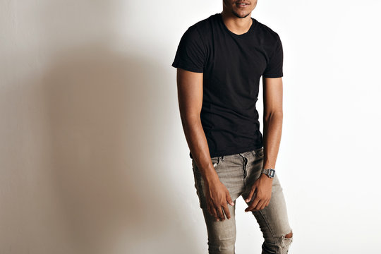 Mockup Shot Of A Plain Black Cotton Short Sleeve T-shirt On An Athletic Black Or Latino Man In A Studio With White Walls