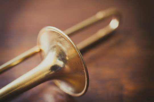 Trombone on wooden floor detail
