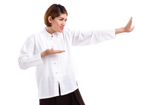 active, strong, confident asian woman practice kungfu or tai chi quan, baguazhang, chinese martial arts concept