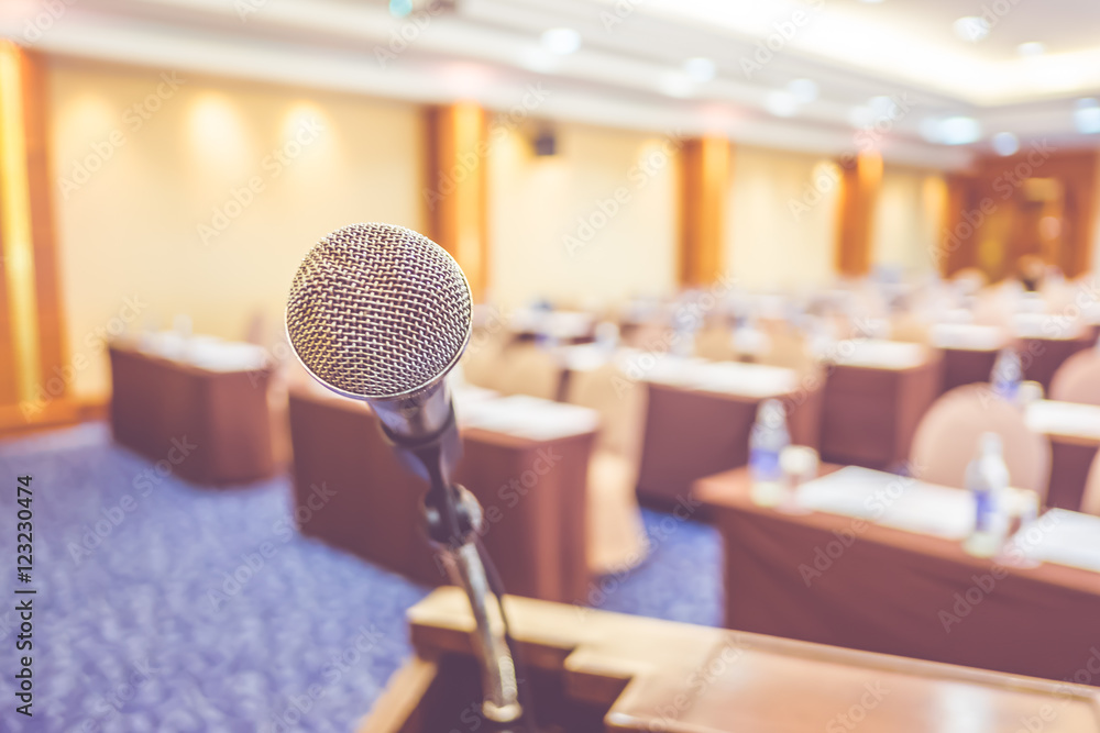 Poster blur background,close up microphone at podium at seminar event r
