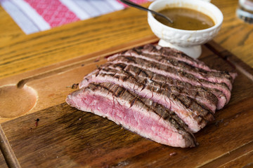 Juicy medium rare beef slice with sauce