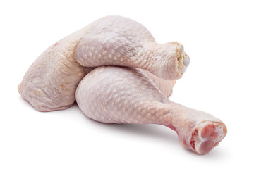 Fresh raw chicken leg quarters on white background