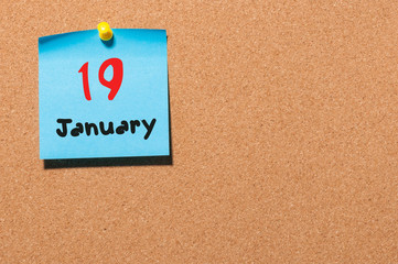 January 19th. Day 19 of month, Calendar on cork notice board. Winter time. Empty space for text