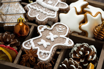 Christmas holiday symbols and cookies in a wooden box, closeup
