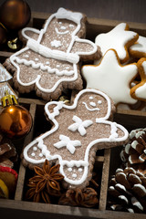 Christmas holiday symbols and cookies in a wooden box, top view