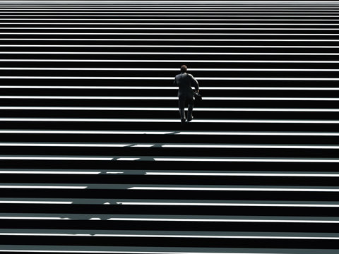 Businessman Running Up The Stairs,