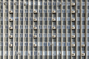 mani air conditioners on the  wall of office building