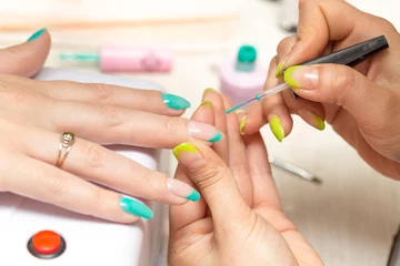 Foto auf Acrylglas women in a beauty salon manicure © schankz