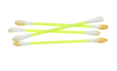 dirty ear sticks on a white background