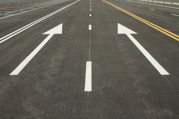 Traffic sign on black asphalt road