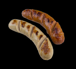 Grilled sausage steak isolated on the black background with clipping path