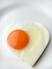 heart-shaped fried eggs on a plate