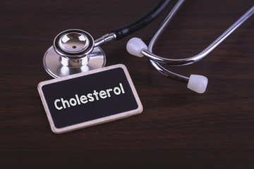 Medical Concept- Cholesterol words written on label tag with Stethosocpe