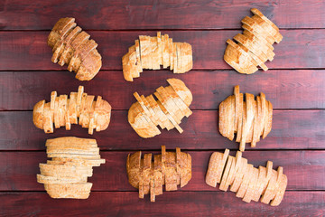 Nine loaves of bread sliced in staggered formation