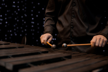 Musician hand playing the xylophone 