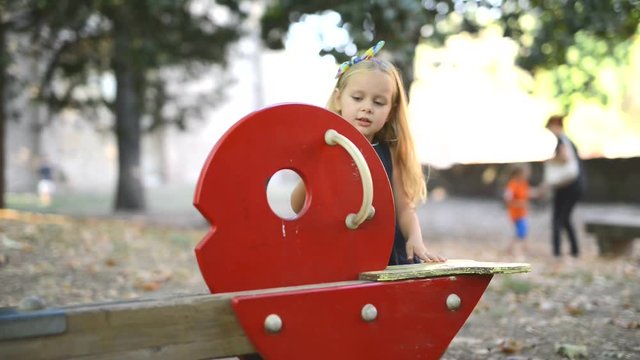 Happy little girl at the playground