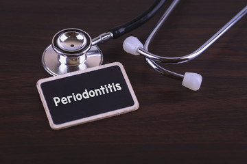 Medical Concept- Periodontitis words written on label tag with Stethoscope