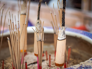 Selective focus on front of josssticks, Incense sticks are burning with smoke use for pay respect to the Buddha 