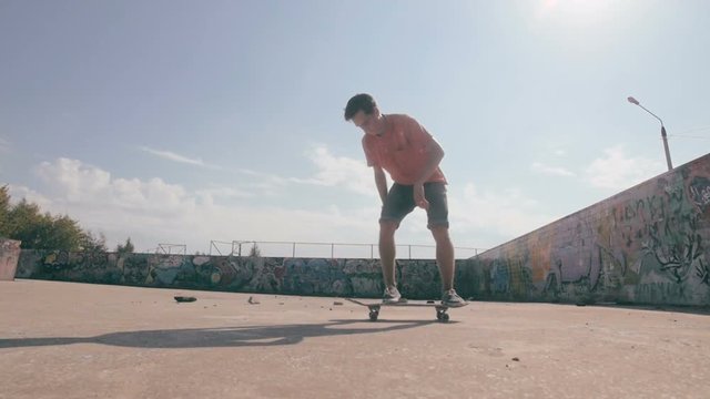 Skateboarder doing trick at sunset. HD