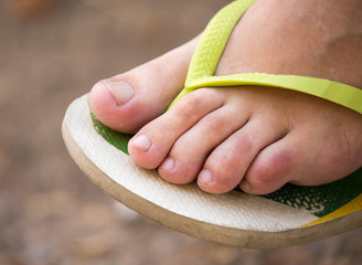 Girl foot in beach footwear