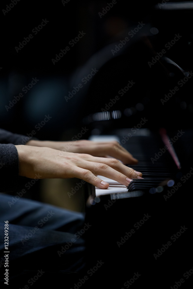 Poster hands musician playing the piano closeup