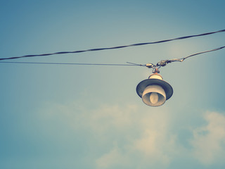 Color filter image/ Old bulb hanging on the sky, Selective focus 