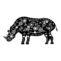 Silhouette of rhino with ancient patterns of African tribes in t