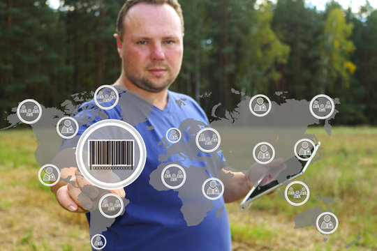 Businessman clicking on the product barcode on the touch panel with a map of the world. Web icons.