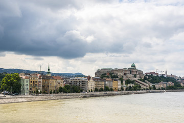 Old colorful houses on Buda side and Budapest Royal palace. Hungary.