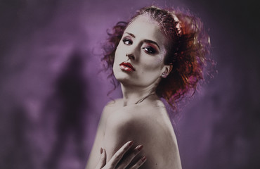 Fototapeta premium Red-haired woman topless with a bright make-up