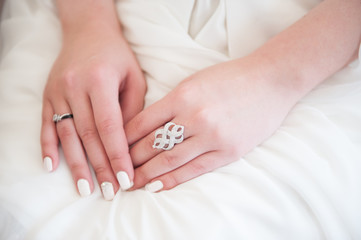 girl's hands with rings and nail polish
