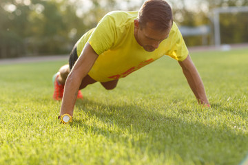Portrait of fitness man in sportswear work-out outdoors