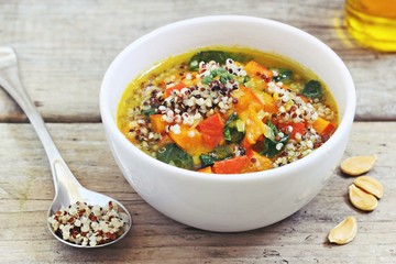 Pumpkin soup with quinoa and spinach. Superfood and clean eating concept.Selective focus
