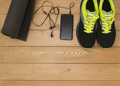 Sports accessories for fitness on the wooden floor.