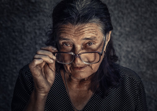 skeptical old woman looking suspicious