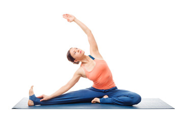 Sporty fit yogini woman practices yoga asana parivrtta janu sirs