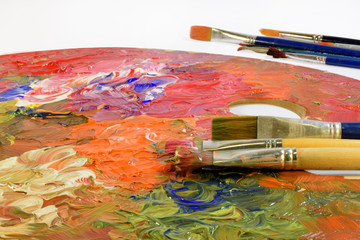Colors on palette and paint brushes