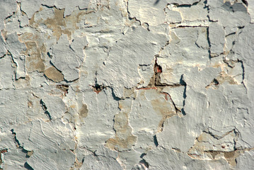 Close-up of an old brick wall under whitewash, texture, background 