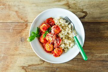meatballs from ricotta cheese and boiled rice in with tomato sau