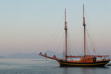 Wooden sailing boat near the islands