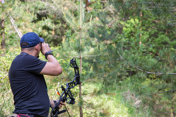 man archer aiming at a target outdoors