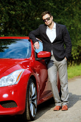 Fototapeta na wymiar handsome by his car