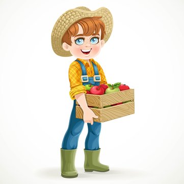 Cute boy farmer in jeans overalls and rubber boots holding a woo
